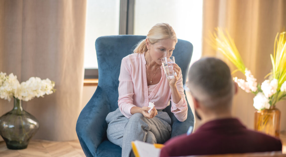 herapist offering tissues during emotional session—depicting support through grief and trauma counselling in Richmond Hill.