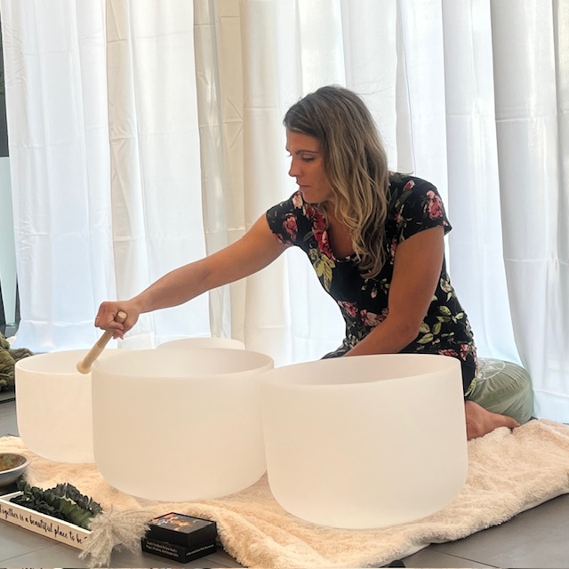 image of music therapist using crystal bowls and Himalayan sound bowls to help with anxiety, sleep and nervous system dysregulation in richmond hill