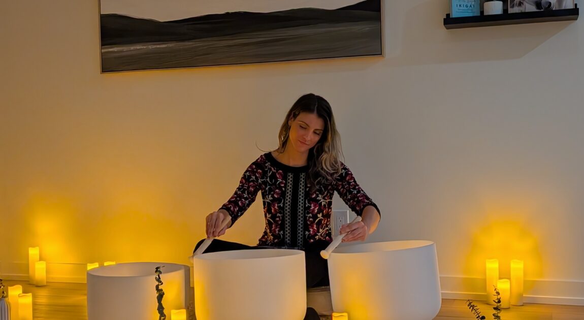 trauma sound bath therapist playing sound therapy with crystals and Himalayan bowls in vaughan psychotherapy center